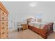Light and airy bedroom with a wooden bed and dresser at 2760 Rialto Ct, Kissimmee, FL 34746