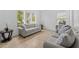 Cozy living room with plush sofas and large windows at 2760 Rialto Ct, Kissimmee, FL 34746