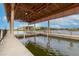 Covered boat lift with access to the water at 2760 Rialto Ct, Kissimmee, FL 34746