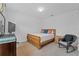 Bright bedroom with a wooden bed frame and rocking chair at 2760 Rialto Ct, Kissimmee, FL 34746