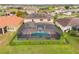 House with a screened-in pool and solar panels at 2760 Rialto Ct, Kissimmee, FL 34746
