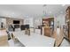 Bright dining area with large table and access to kitchen and Gathering room at 2760 Rialto Ct, Kissimmee, FL 34746