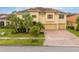Two-story house with tile roof and three-car garage at 2760 Rialto Ct, Kissimmee, FL 34746