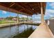Community boat dock with covered slips and access to the water at 2760 Rialto Ct, Kissimmee, FL 34746