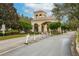 Gated community entrance with guardhouse and landscaping at 2760 Rialto Ct, Kissimmee, FL 34746