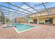 Resort-style pool with covered patio and ample seating at 2760 Rialto Ct, Kissimmee, FL 34746