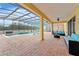 Covered patio with pool and lounge area at 2760 Rialto Ct, Kissimmee, FL 34746