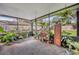 Relaxing screened porch with lush potted plants at 3092 Nicholson Dr, Winter Park, FL 32792