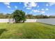 Large backyard with grassy area, storage shed, and fenced enclosure at 3133 Queen Alexandria Dr, Kissimmee, FL 34744