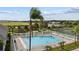 Community pool with surrounding patio and lounge chairs at 3133 Queen Alexandria Dr, Kissimmee, FL 34744