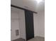 Laundry closet with sliding barn door and shelving at 3245 Sustainable Way, Kissimmee, FL 34747