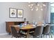 Dining room with mid-century modern table and chairs at 4410 Le Reve Ct, Kissimmee, FL 34746