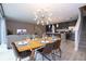 Open concept dining area with kitchen and living room views at 4410 Le Reve Ct, Kissimmee, FL 34746