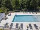 Clean and inviting community pool with plenty of lounge chairs at 4410 Le Reve Ct, Kissimmee, FL 34746