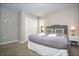 King size bed, nightstands with lamps, and a closet at 4410 Le Reve Ct, Kissimmee, FL 34746