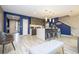 Open concept kitchen and living area with modern finishes at 4410 Le Reve Ct, Kissimmee, FL 34746