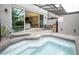 Outdoor spa with patio access and view of living area at 4410 Le Reve Ct, Kissimmee, FL 34746