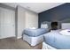 Guest bedroom with two twin beds and a closet at 4410 Le Reve Ct, Kissimmee, FL 34746