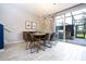 Mid-century modern dining area with access to the backyard at 4410 Le Reve Ct, Kissimmee, FL 34746