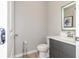 Clean powder room with gray vanity and modern fixtures at 4410 Le Reve Ct, Kissimmee, FL 34746