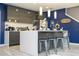 Modern kitchen with gray cabinets, island, and pendant lighting at 4410 Le Reve Ct, Kissimmee, FL 34746
