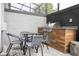 Outdoor kitchen with grill and dining area at 4410 Le Reve Ct, Kissimmee, FL 34746