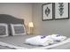 Bedroom with a king-size bed and gray bedding at 4410 Le Reve Ct, Kissimmee, FL 34746