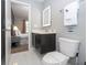 Bathroom with a vanity, toilet, and view into a bedroom at 4410 Le Reve Ct, Kissimmee, FL 34746