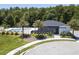 Community pool and cabana with lush landscaping and palm trees at 4410 Le Reve Ct, Kissimmee, FL 34746