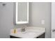 Simple bathroom with a lighted mirror and vanity at 4410 Le Reve Ct, Kissimmee, FL 34746