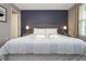 Bedroom with a large bed, nightstands, and a view of another room at 4410 Le Reve Ct, Kissimmee, FL 34746