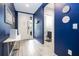 Bright entryway with powder room and modern console table at 4410 Le Reve Ct, Kissimmee, FL 34746