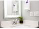 Small modern bathroom with vanity and illuminated mirror at 4410 Le Reve Ct, Kissimmee, FL 34746