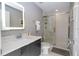 Modern bathroom with a walk-in shower, vanity, and updated fixtures at 4410 Le Reve Ct, Kissimmee, FL 34746
