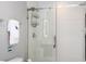 Bathroom with shower, toilet, and white tiled walls at 4410 Le Reve Ct, Kissimmee, FL 34746