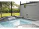 Private screened-in spa with waterfall feature at 4410 Le Reve Ct, Kissimmee, FL 34746