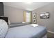 Bedroom with two twin beds, a TV, and window coverings at 4410 Le Reve Ct, Kissimmee, FL 34746