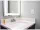 Modern bathroom vanity with illuminated mirror and chrome fixtures at 4410 Le Reve Ct, Kissimmee, FL 34746