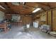 Unfinished garage with workbench, washer, and storage at 4908 Seminole Ave, Winter Park, FL 32792