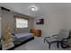 Bedroom with a double bed and armchair at 4908 Seminole Ave, Winter Park, FL 32792