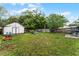 Large backyard with shed, lawn, and wooden fence at 4908 Seminole Ave, Winter Park, FL 32792