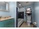Small bathroom with blue tile, shower/tub combo, and toilet at 4908 Seminole Ave, Winter Park, FL 32792