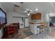 Kitchen features wood cabinets, tiled floors, and breakfast bar at 4908 Seminole Ave, Winter Park, FL 32792