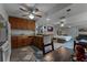 Open kitchen with wood cabinets and breakfast bar at 4908 Seminole Ave, Winter Park, FL 32792