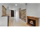 Living room with stone fireplace and tiled floors at 4908 Seminole Ave, Winter Park, FL 32792