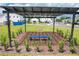 Relaxing shaded seating area with a blue bench underneath a modern pergola at 1541 Heritage Pl, Oviedo, FL 32765
