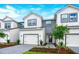 Two-story townhome with modern facade and attached garage at 1541 Heritage Pl, Oviedo, FL 32765