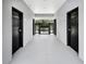 Hallway leading to the community pool with two doors on either side at 1541 Heritage Pl, Oviedo, FL 32765