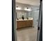 Bathroom with double vanity, large mirror and walk-in shower at 1554 Outback W Rd, St Cloud, FL 34771