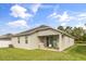 Backyard features a covered patio, great for outdoor entertaining at 1554 Outback W Rd, St Cloud, FL 34771